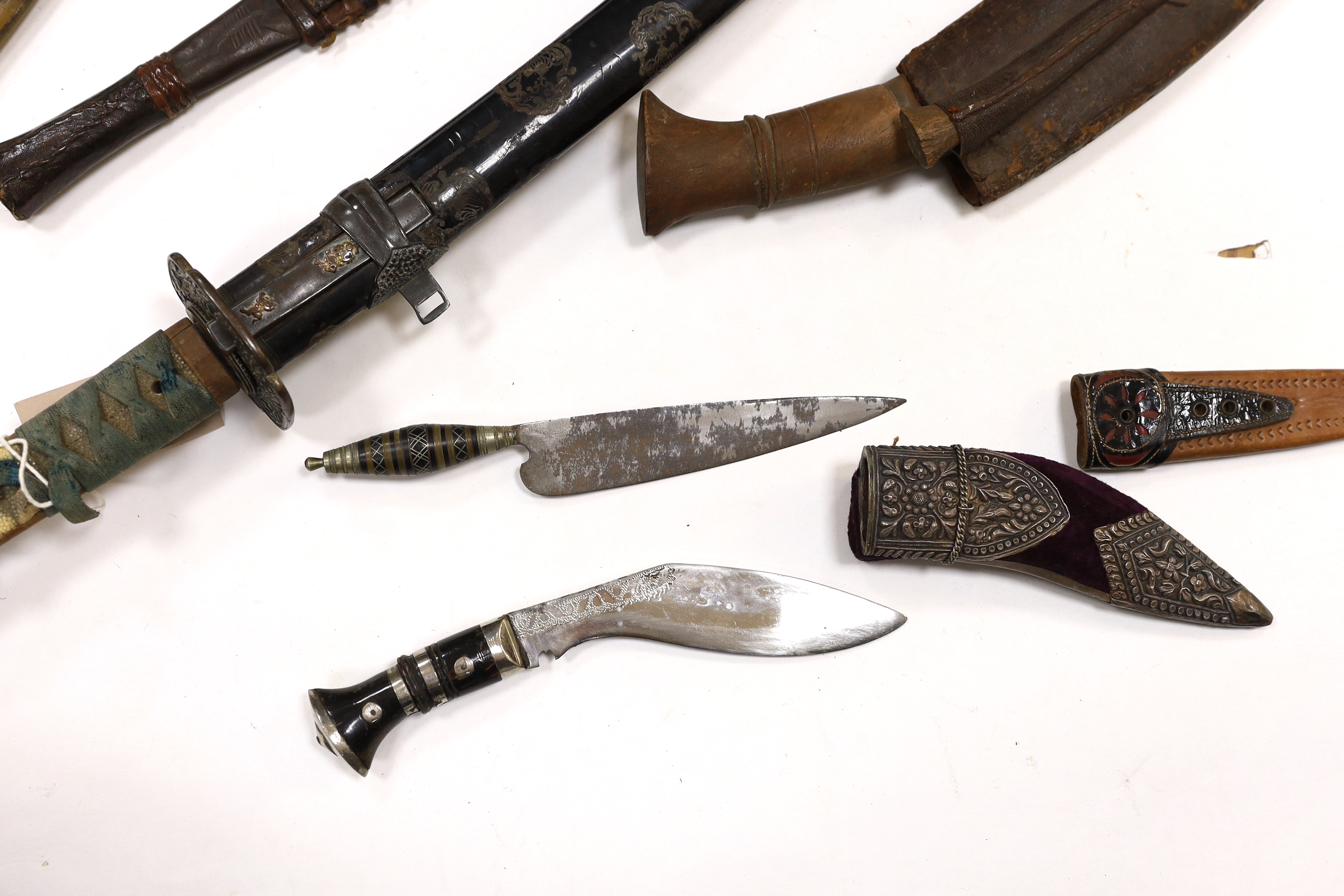 A 19th century Japanese katana with signature to the tang, with chiselled bronze tsuba and gilt metal menuki, and six various knives, blade 57cm